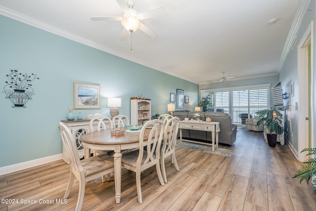 dining space with light hardwood / wood-style floors, ceiling fan, and ornamental molding