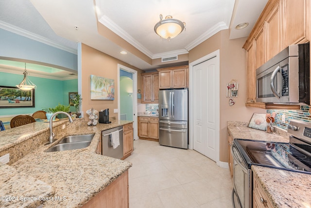 kitchen featuring appliances with stainless steel finishes, hanging light fixtures, crown molding, and sink