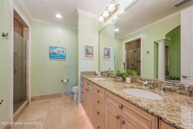 bathroom with vanity, toilet, ornamental molding, an enclosed shower, and decorative columns