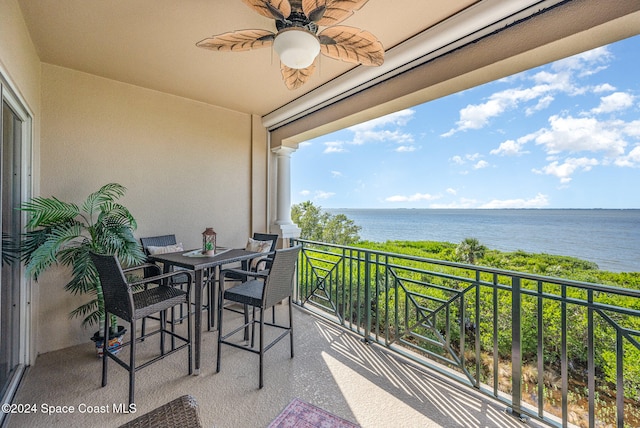 balcony featuring a water view