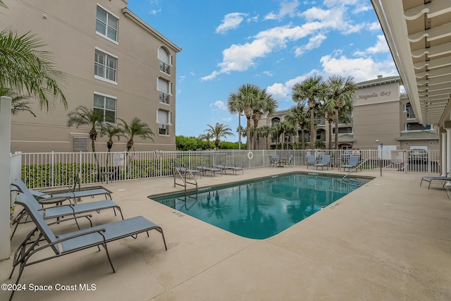 view of swimming pool with a patio area