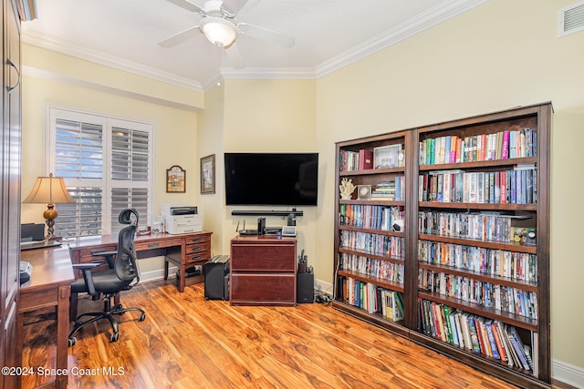 home office with hardwood / wood-style flooring, ceiling fan, and ornamental molding