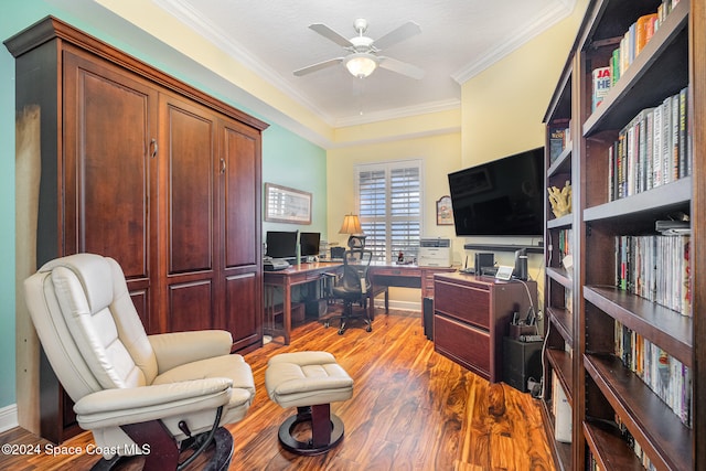 office featuring hardwood / wood-style floors, ceiling fan, and crown molding