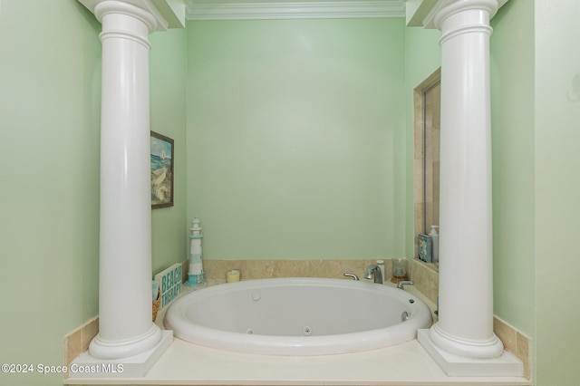 bathroom with a tub and ornamental molding