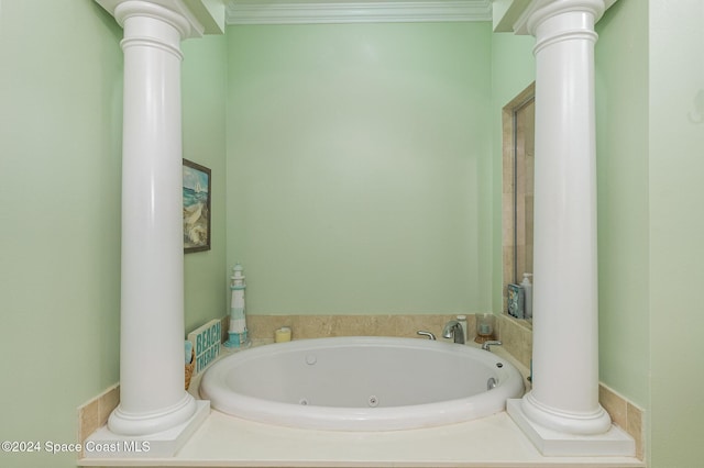 2022 Julep Dr Unit 202, Cocoa Beach, FL 32931 - bathroom featuring a whirlpool tub, decorative columns, and ornamental molding