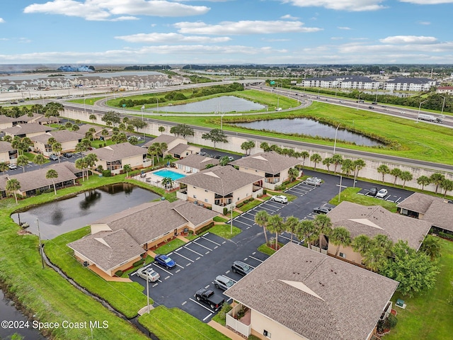 birds eye view of property with a water view