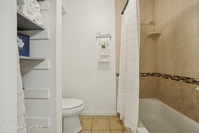 bathroom with tile patterned floors, toilet, and shower / tub combo with curtain