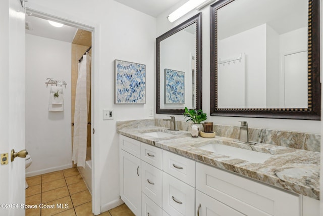 bathroom with shower / tub combo, vanity, and tile patterned floors