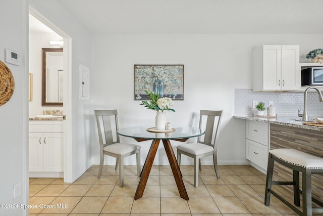 tiled dining space with sink