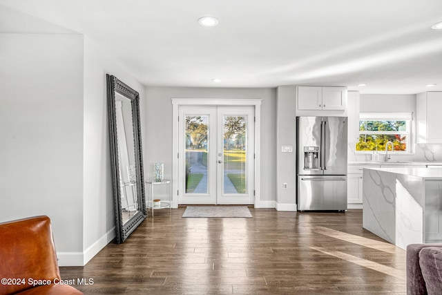 doorway to outside with plenty of natural light, sink, dark wood-type flooring, and french doors