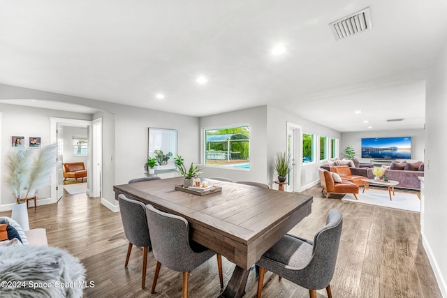 dining room with wood-type flooring