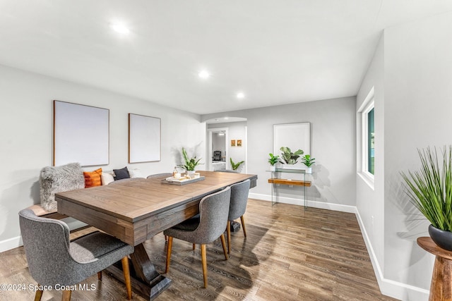 dining room with hardwood / wood-style flooring