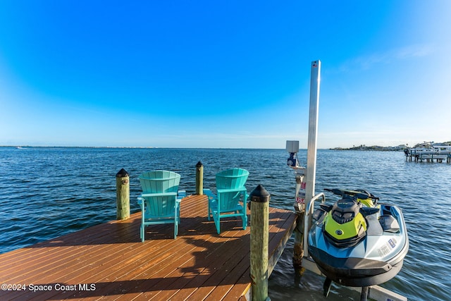 dock area featuring a water view