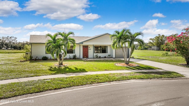 single story home with a garage and a front lawn