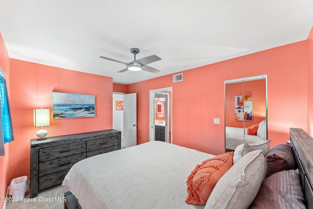 carpeted bedroom with ceiling fan, connected bathroom, and a closet