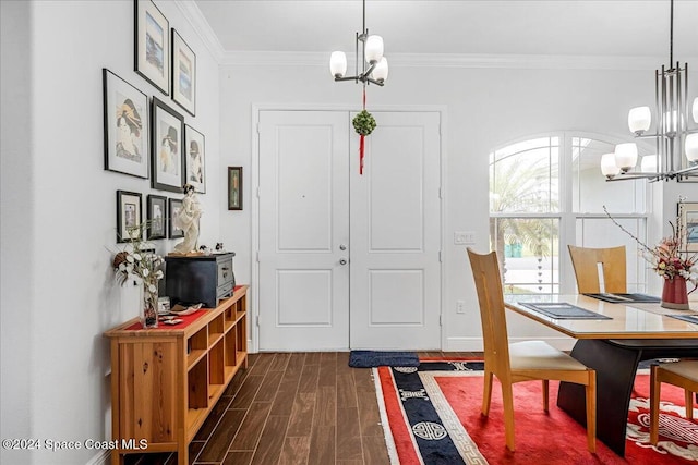 interior space featuring an inviting chandelier, dark hardwood / wood-style floors, and ornamental molding