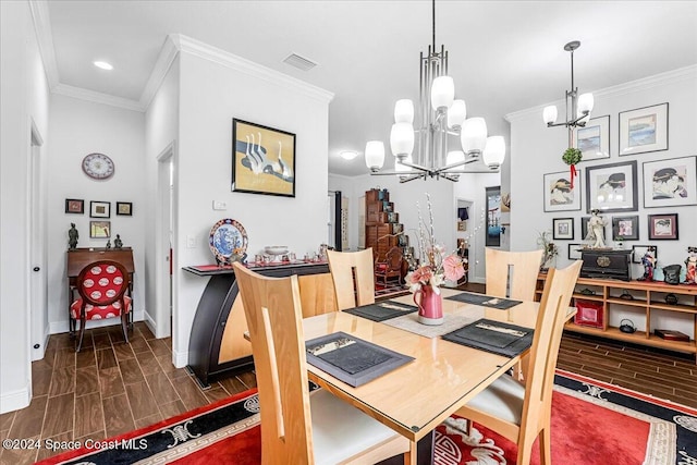 dining area with ornamental molding, dark wood-type flooring, and an inviting chandelier