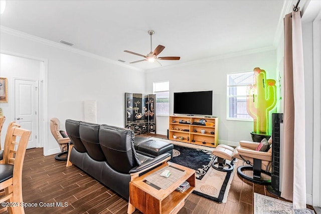 living room with crown molding, dark hardwood / wood-style flooring, and ceiling fan