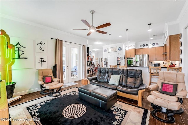 living room featuring hardwood / wood-style floors, ceiling fan, and ornamental molding