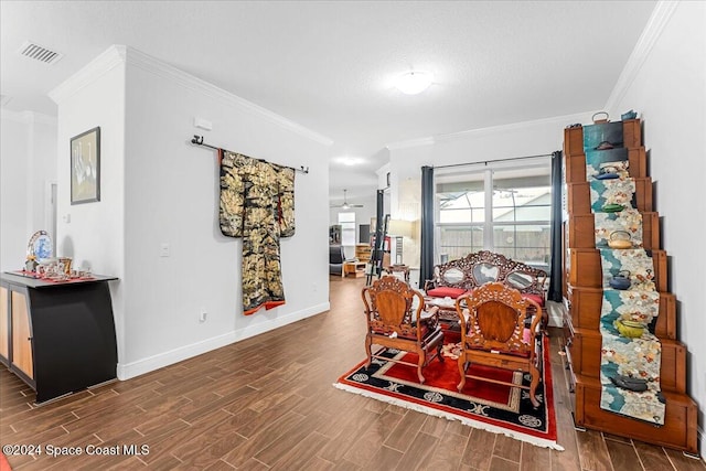 dining area featuring a textured ceiling, ceiling fan, dark hardwood / wood-style flooring, and crown molding