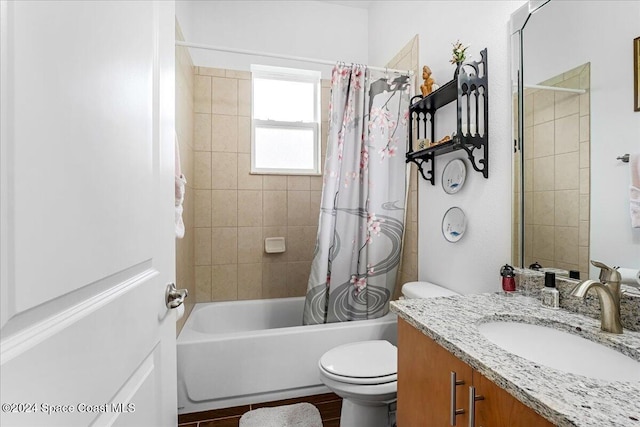 full bathroom featuring vanity, shower / tub combo, and toilet