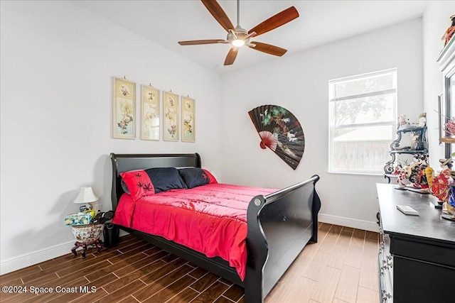 bedroom with hardwood / wood-style flooring and ceiling fan