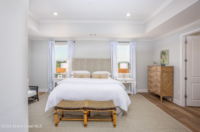 bedroom featuring hardwood / wood-style flooring and ornamental molding