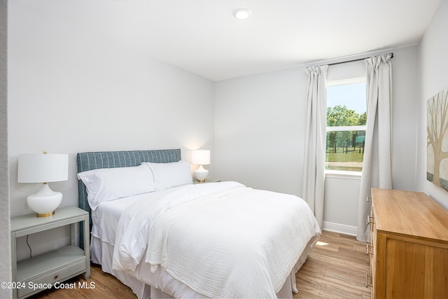 bedroom with light hardwood / wood-style floors