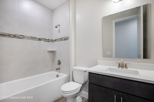 bathroom with shower / washtub combination, toilet, and vanity