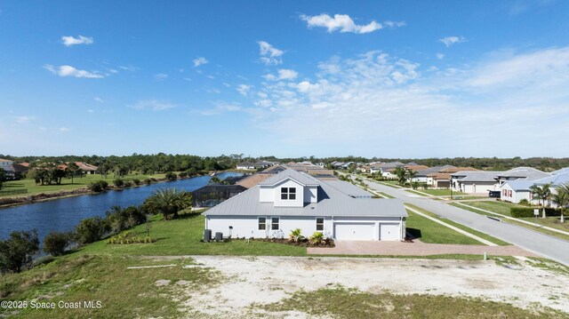 aerial view featuring a residential view and a water view