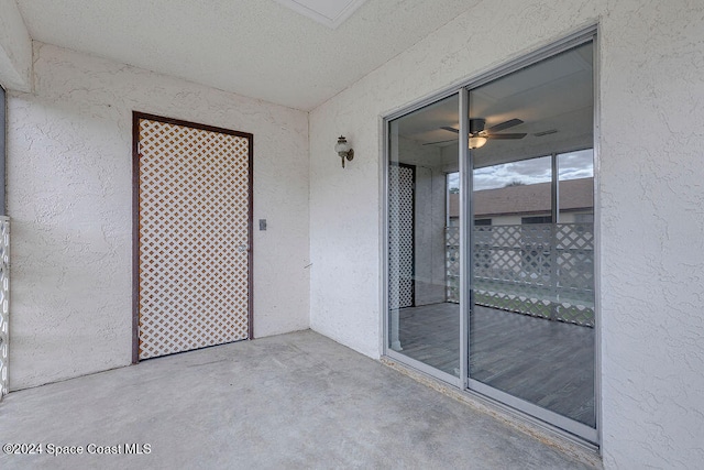 unfurnished room featuring concrete floors and a textured ceiling