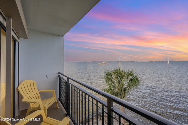 balcony at dusk with a water view