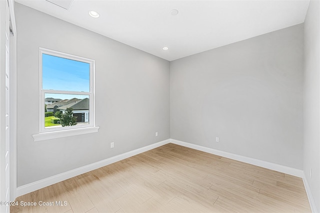 unfurnished room with light wood-type flooring