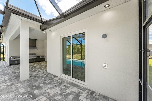 unfurnished sunroom featuring a skylight