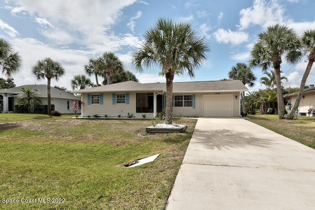 ranch-style home with a front lawn and a garage