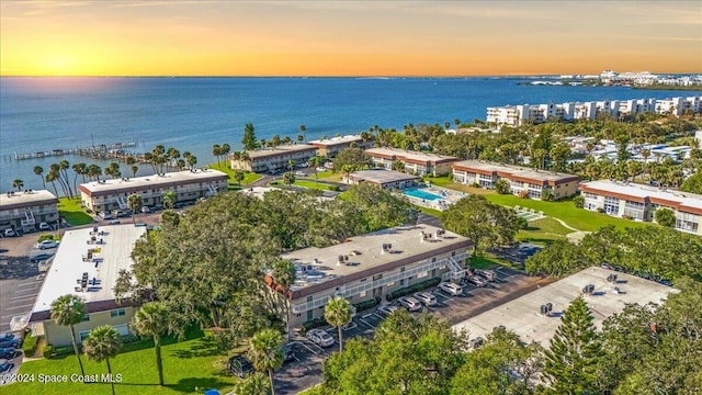 aerial view at dusk with a water view