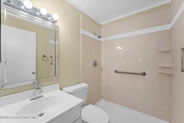 bathroom featuring vanity, toilet, crown molding, and walk in shower