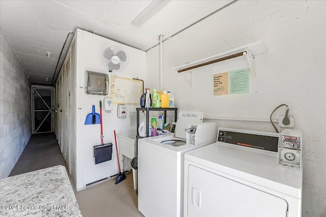 laundry area with independent washer and dryer