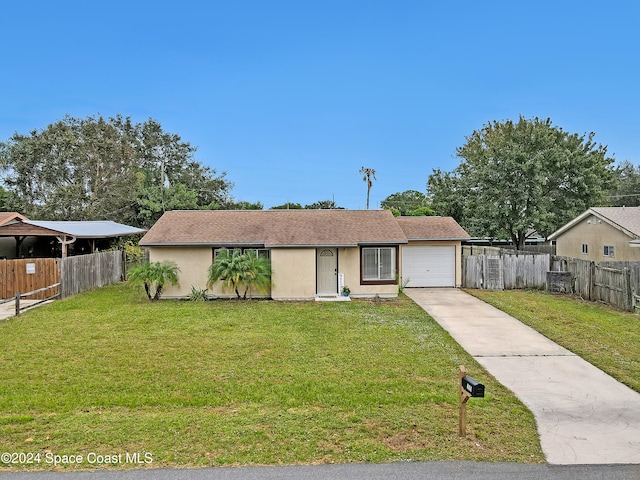 view of front of house featuring a garage and a front yard