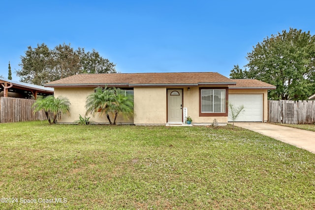 single story home featuring a garage and a front yard