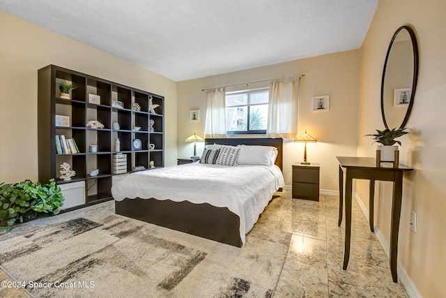 bedroom featuring a textured ceiling