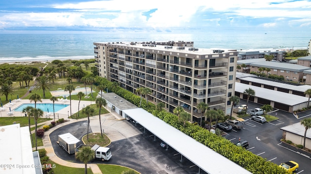 exterior space with a beach view and a water view