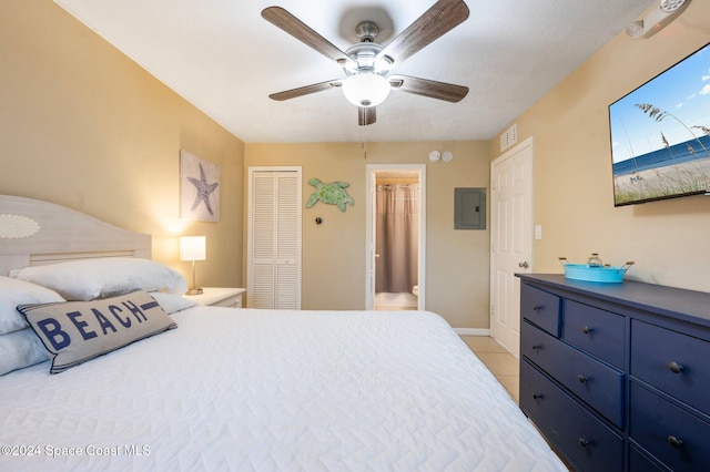 bedroom with electric panel, ceiling fan, and light tile patterned floors