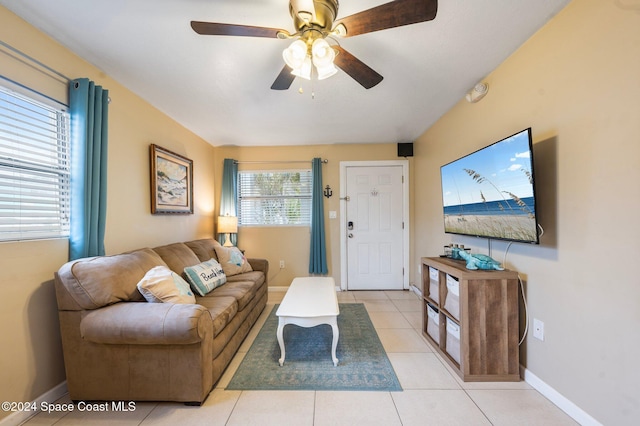 living room with light tile patterned floors and ceiling fan