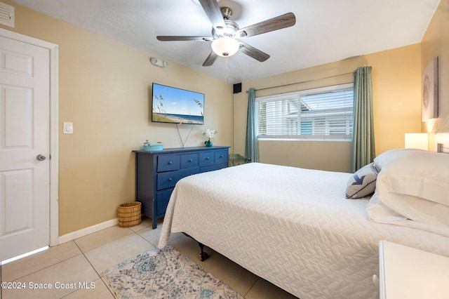 bedroom featuring ceiling fan and light tile patterned floors