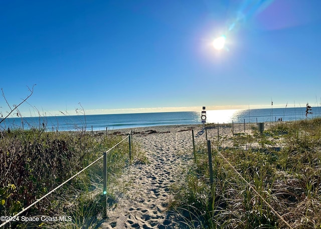 property view of water featuring a beach view