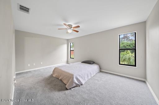 bedroom with carpet flooring and ceiling fan