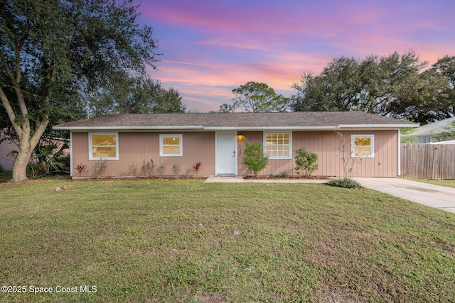 ranch-style house with a lawn