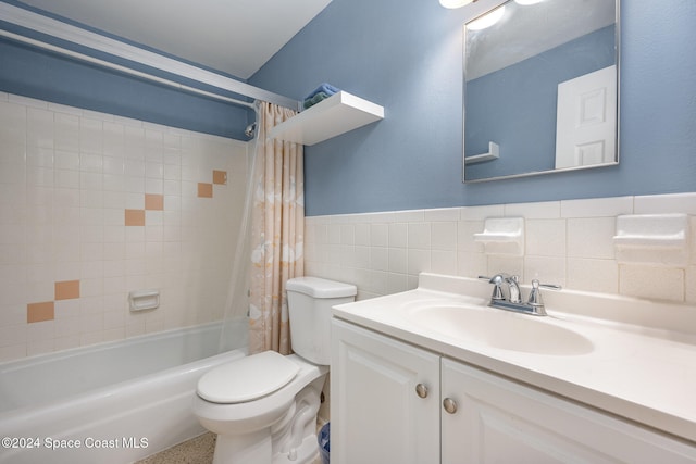 full bathroom with vanity, shower / bathtub combination with curtain, tile walls, and toilet