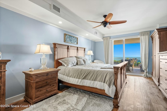 bedroom with access to outside, ceiling fan, and light wood-type flooring